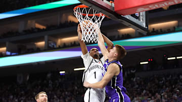 Nov 24, 2024; Sacramento, California, USA; Brooklyn Nets forward Ziaire Williams (1) shoots against Sacramento Kings guard Kevin Huerter (right) during the second quarter at Golden 1 Center. Mandatory Credit: Darren Yamashita-Imagn Images