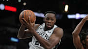 Oct 18, 2023; San Antonio, Texas, USA; San Antonio Spurs center Charles Bassey (28) rebounds in the second half against the Houston Rockets at the Frost Bank Center. Mandatory Credit: Daniel Dunn-Imagn Images