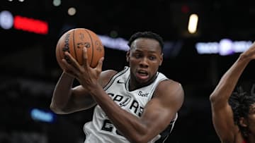 Oct 18, 2023; San Antonio, Texas, USA; San Antonio Spurs center Charles Bassey (28) rebounds in the second half against the Houston Rockets at the Frost Bank Center. Mandatory Credit: Daniel Dunn-Imagn Images