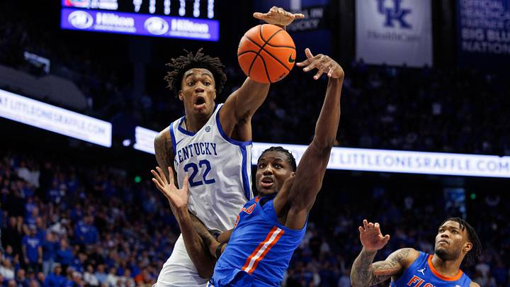 Jan 4, 2025; Lexington, Kentucky, USA; Florida Gators center Rueben Chinyelu (9) and Kentucky Wildcats center Amari Williams (22) reach for a rebound during the second half at Rupp Arena at Central Bank Center. Mandatory Credit: Jordan Prather-Imagn Images