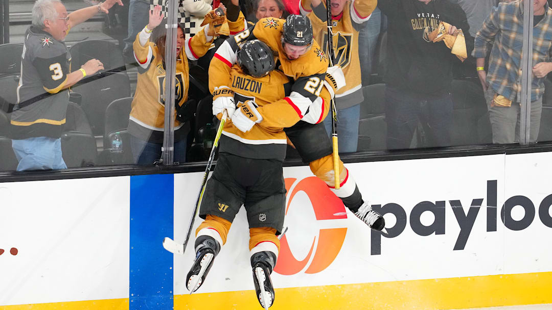 Apr 29, 2026; Las Vegas, Nevada, USA; Vegas Golden Knights center Brett Howden (21) celebrates with Vegas Golden Knights defenseman Jeremy Lauzon (5) after scoring a game winning goal against the Utah Mammoth during the second overtime period of game five of the first round of the 2026 Stanley Cup Playoffs at T-Mobile Arena. Mandatory Credit: Stephen R. Sylvanie-Imagn Images