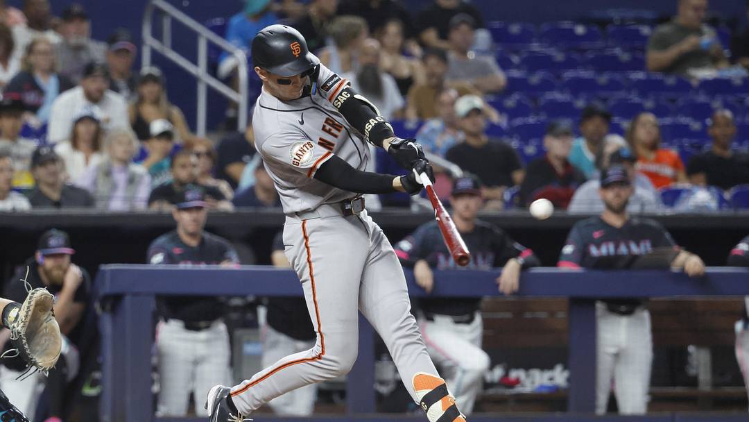 Jun 19, 2026; Miami, Florida, USA;  San Francisco Giants catcher Daniel Susac (6) hits a sacrifice fly ball against the Miami Marlins during the second inning at loanDepot Park. Mandatory Credit: Rhona Wise-Imagn Images