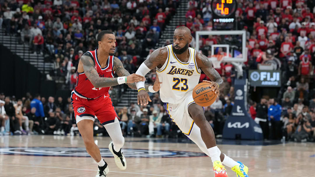 Dec 20, 2025; Inglewood, California, USA; Los Angeles Lakers forward Lebron James (23) is defended by LA Clippers forward John Collins (20) in the second half at Intuit Dome. Mandatory Credit: Kirby Lee-Imagn Images