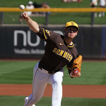 Feb 25, 2025; Peoria, Arizona, USA; San Diego Padres pitcher Stephen Kolek (32) throws against the Los Angeles Angels during the first inning at Peoria Sports Complex. Mandatory Credit: Rick Scuteri-Imagn Images