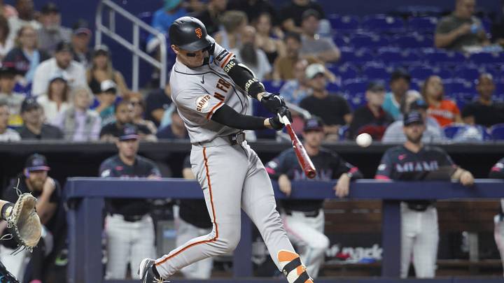 Jun 19, 2026; Miami, Florida, USA;  San Francisco Giants catcher Daniel Susac (6) hits a sacrifice fly ball against the Miami Marlins during the second inning at loanDepot Park. Mandatory Credit: Rhona Wise-Imagn Images