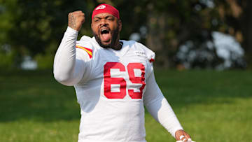 Jul 22, 2024; St. Joseph, MO, USA; Kansas City Chiefs defensive tackle Mike Pennel Jr. (69) gestures to fans while walking from the locker room to the fields prior to training camp at Missouri Western State University. Mandatory Credit: Denny Medley-Imagn Images