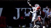 Cincinnati Bearcats wide receiver Jeff Caldwell (9) catches a pass as Bowling Green Falcons cornerback Jalen McClendon (8) defends in the second quarter of the NCAA football game between the Cincinnati Bearcats and Bowling Green Falcons at Nippert Stadium in Cincinnati on Sept. 6, 2025.
