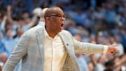 Mar 8, 2025; Chapel Hill, North Carolina, USA;  North Carolina Tar Heels head coach Hubert Davis reacts in the first half at Dean E. Smith Center. Mandatory Credit: Bob Donnan-Imagn Images