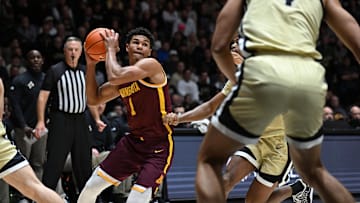 Dec 10, 2025; West Lafayette, Indiana, USA; Minnesota Golden Gophers guard Isaac Asuma (1) jukes in front of multiple Purdue Boilermakers during the first half at Mackey Arena. Mandatory Credit: Marc Lebryk-Imagn Images