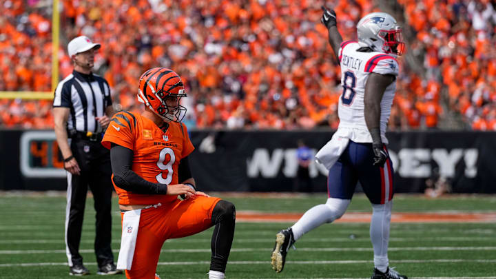 Sep 8, 2024; Cincinnati, Ohio, USA; New England Patriots linebacker Ja'Whaun Bentley (8) celebrates after stripping the ball from Cincinnati Bengals quarterback Joe Burrow (9) in the third quarter at Paycor Stadium. Mandatory Credit: Sam Greene/USA TODAY Network via Imagn Images