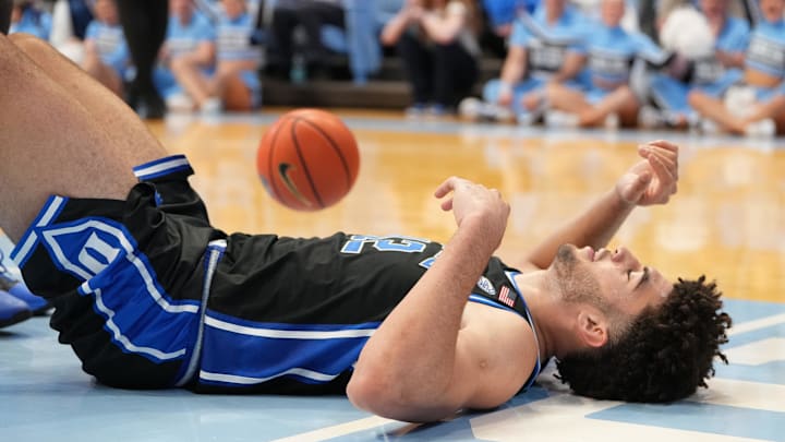 Feb 7, 2026; Chapel Hill, North Carolina, USA; Duke Blue Devils forward Cameron Boozer (12) on the floor in the second half at Dean E. Smith Center.
