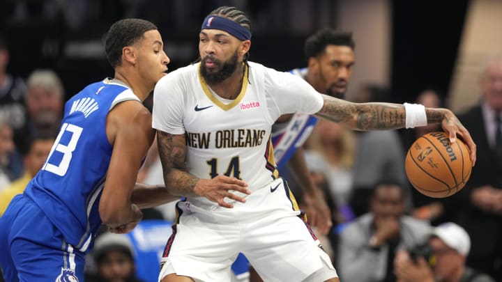 Dec 4, 2023; Sacramento, California, USA; New Orleans Pelicans forward Brandon Ingram (14) dribbles against Sacramento Kings forward Keegan Murray (13) during the first quarter at Golden 1 Center.