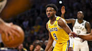 Mar 20, 2025; Los Angeles, California, USA; Los Angeles Lakers guard Bronny James (9) defends against the Milwaukee Bucks during the first half at Crypto.com Arena. Mandatory Credit: Jonathan Hui-Imagn Images