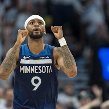 May 8, 2025; Minneapolis, Minnesota, USA; Minnesota Timberwolves guard Nickeil Alexander-Walker (9) celebrates after making a three point shot against the Golden State Warriors in the second half during game two of the second round for the 2025 NBA Playoffs at Target Center. Mandatory Credit: Jesse Johnson-Imagn Images