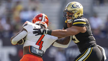 Sep 30, 2023; Atlanta, Georgia, USA; Georgia Tech Yellow Jackets linebacker Charles Rosser (13) tackles Virginia Tech Hokies running back Terion Stewart (4) during the first half at Hyundai Field. Mandatory Credit: Dale Zanine-Imagn Images