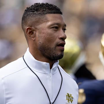 Notre Dame head coach Marcus Freeman jogs the field during warm ups before a NCAA college football game between Notre Dame and Northern Illinois at Notre Dame Stadium on Saturday, Sept. 7, 2024, in South Bend.