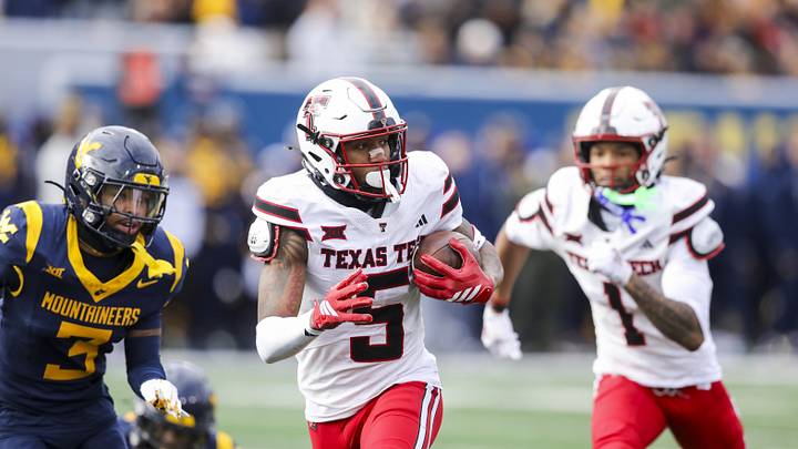 Nov 29, 2025; Morgantown, West Virginia, USA; Texas Tech Red Raiders wide receiver Caleb Douglas (5) makes a catch and runs for extra yards during the second quarter against the West Virginia Mountaineers at Milan Puskar Stadium. Mandatory Credit: Ben Queen-Imagn Images