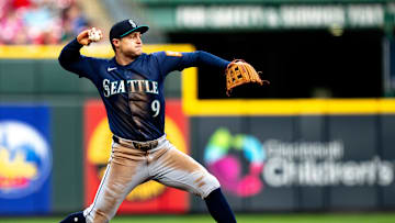 Seattle Mariners third baseman Ben Williamson (9) throws out Cincinnati Reds first baseman Christian Encarnacion-Strand (33) in the third inning of the MLB game between Cincinnati Reds and Seattle Mariners at Great American Ball Park in Cincinnati on Wednesday, April 16, 2025.