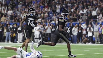 Colorado Buffaloes wide receiver Travis Hunter runs with the ball and scores a touchdown