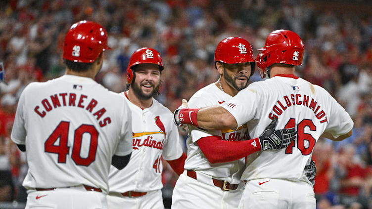 Jul 30, 2024; St. Louis, Missouri, USA;  St. Louis Cardinals pinch hitter Tommy Pham (29) celebrates with left fielder Alec Burleson (41) first baseman Paul Goldschmidt (46) and catcher Willson Contreras (40) after hitting a grand slam home run against the Texas Rangers during the fifth inning at Busch Stadium. Mandatory Credit: Jeff Curry-USA TODAY Sports