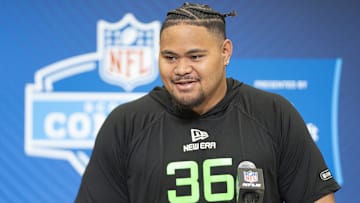 University of Arizona offensive lineman Jonah Savaiinaea (OL36) answers questions at a press conference during the 2025 NFL Combine at Indiana Convention Center.
