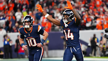 Sep 29, 2025; Denver, Colorado, USA; Denver Broncos wide receiver Courtland Sutton (14) celebrates after scoring a touchdown  on a pass from Denver Broncos quarterback Bo Nix (10) during the second quarter against the Cincinnati Bengals at Empower Field at Mile High. 