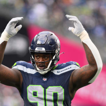 Oct 22, 2023; Seattle, Washington, USA; Seattle Seahawks defensive tackle Jarran Reed (90) interacts with the fans during the game against the Arizona Cardinals at Lumen Field. Mandatory Credit: Steven Bisig-USA TODAY Sports