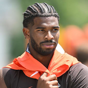 Jun 10, 2025; Berea, OH, USA; Cleveland Browns quarterback Shedeur Sanders (12) walks off the field during minicamp at CrossCountry Mortgage Campus.