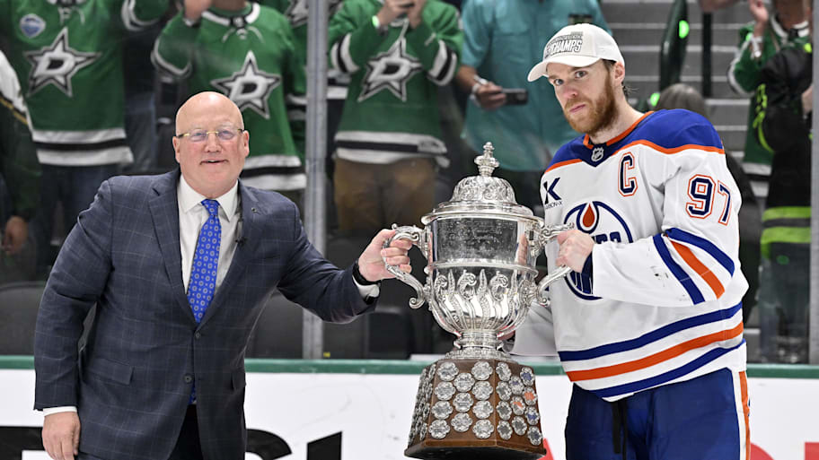 NHL deputy commissioner Bill Daly and Edmonton Oilers center Connor McDavid (97) pose with the trophy after winning the Western Conference Final of the 2025 Stanley Cup Playoffs at American Airlines Center. | Jerome Miron-Imagn Images