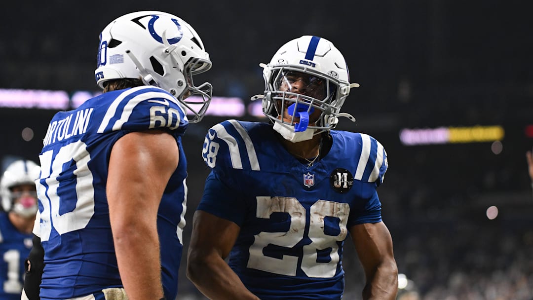Indianapolis Colts running back Jonathan Taylor (28) celebrates with Indianapolis Colts center Tanor Bortolini (60) after scoring a touchdown. Indianapolis Colts running back Jonathan Taylor (28) celebrates with Indianapolis Colts center Tanor Bortolini (60) after scoring a touchdown.