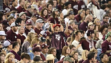 Nov 16, 2024; College Station, Texas, USA; A young fan cheers during the second half of the game between the Texas A&M Aggies and the New Mexico State Aggies at Kyle Field. Mandatory Credit: Maria Lysaker-Imagn Images 