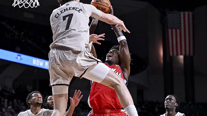 Feb 18, 2026; College Station, Texas, USA; Ole Miss Rebels guard AJ Storr (2) is fouled by Texas A&M Aggies forward Zach Clemence (7) during the first half at Reed Arena. Mandatory Credit: Maria Lysaker-Imagn Images 