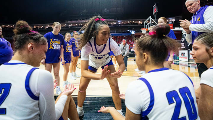 Johnston's Jenica Lewis (10) takes the floor during player introductions for the 5A quarterfinal against Iowa City Liberty on Monday, March 3, 2025, at Wells Fargo Arena.