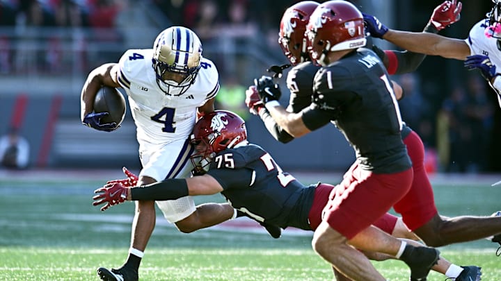 Sep 20, 2025; Pullman, Washington, USA; Washington State Cougars safety Cale Reeder (25) makes the diving tackle on Washington Huskies running back Jordan Washington (4) in the first half of Apple Cup at Gesa Field at Martin Stadium. Mandatory Credit: James Snook-Imagn Images