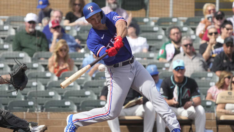 Feb 27, 2024; Salt River Pima-Maricopa, Arizona, USA; Texas Rangers left fielder Wyatt Langford (82)