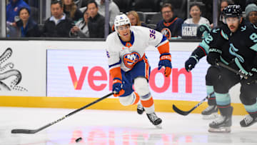 Nov 16, 2024; Seattle, Washington, USA; New York Islanders defenseman Isaiah George (36) passes the puck against the Seattle Kraken during the second period at Climate Pledge Arena. Mandatory Credit: Steven Bisig-Imagn Images