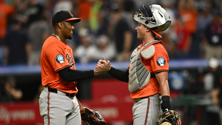 Aug 3, 2024; Cleveland, Ohio, USA; Baltimore Orioles relief pitcher Yennier Cano and catcher James McCann celebrate.