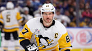 Mar 27, 2025; Buffalo, New York, USA;  Pittsburgh Penguins center Sidney Crosby (87) looks for the puck during the third period against the Buffalo Sabres at KeyBank Center. Mandatory Credit: Timothy T. Ludwig-Imagn Images