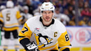 Mar 27, 2025; Buffalo, New York, USA;  Pittsburgh Penguins center Sidney Crosby (87) looks for the puck during the third period against the Buffalo Sabres at KeyBank Center. Mandatory Credit: Timothy T. Ludwig-Imagn Images