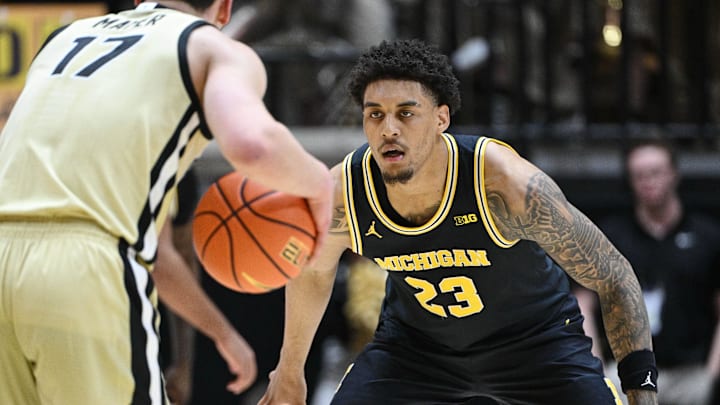 Feb 17, 2026; West Lafayette, Indiana, USA;  Michigan Wolverines forward Yaxel Lendeborg (23) defends against Purdue Boilermakers guard Omer Mayer (17) during the first half at Mackey Arena. Mandatory Credit: Marc Lebryk-Imagn Images
