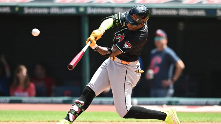 Aug 7, 2024; Cleveland, Ohio, USA; Arizona Diamondbacks shortstop Geraldo Perdomo (2) hits a two-run home run during the second inning against the Cleveland Guardians at Progressive Field. Mandatory Credit: Ken Blaze-USA TODAY Sports