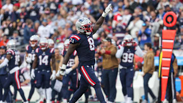 Nov 5, 2023; Foxborough, Massachusetts, USA; New England Patriots linebacker Ja'Whaun Bentley (8) celebrates after sacking Washington Commanders quarterback Sam Howell (14) during the second half at Gillette Stadium. Mandatory Credit: Paul Rutherford-Imagn Images