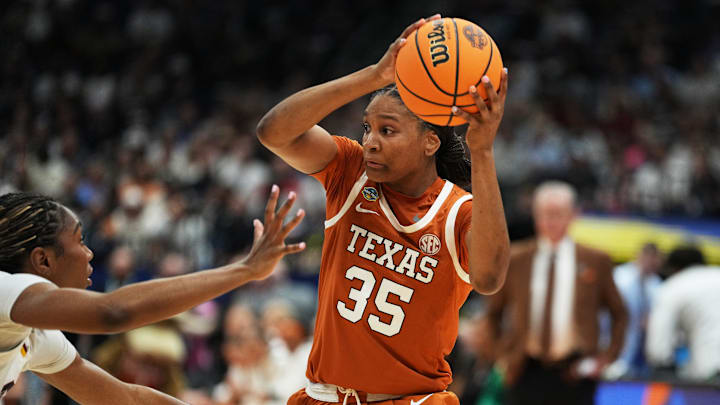 Texas Longhorns forward Madison Booker (35) looks for a way around defense from South Carolina Gamecocks during the NCAA semi-final game at Amalie Arena in Tampa, Florida, Friday April 4, 2025.