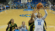Dec 7, 2025; Los Angeles, California, USA;  UCLA Bruins center Lauren Betts (51) drives past Oregon Ducks forward Ehis Etute (35) for a basket during the first half at Pauley Pavilion presented by Wescom Financial. Mandatory Credit: Jayne Kamin-Oncea-Imagn Images