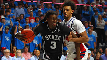 Feb 15, 2025; Oxford, Mississippi, USA; Mississippi State Bulldogs forward KeShawn Murphy (3) drives to the basket as Mississippi Rebels forward Jaemyn Brakefield (4) defends during the first half at The Sandy and John Black Pavilion at Ole Miss. Mandatory Credit: Petre Thomas-Imagn Images