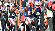 Oct 26, 2025; Foxborough, Massachusetts, USA;  New England Patriots safety Jaylinn Hawkins (21) reacts after intercepting the ball during the third quarter against the Cleveland Browns at Gillette Stadium. Mandatory Credit: Brian Fluharty-Imagn Images