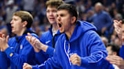 Jan 18, 2025; Lexington, Kentucky, USA; Kentucky Wildcats guard Kerr Kriisa cheers on his teammates from the bench during the first half against the Alabama Crimson Tide at Rupp Arena at Central Bank Center. Mandatory Credit: Jordan Prather-Imagn Images
