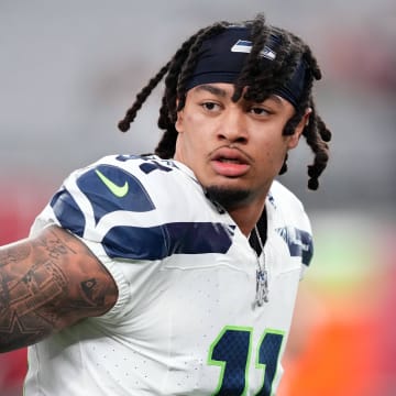 Jan 7, 2024; Glendale, Arizona, USA; Seattle Seahawks wide receiver Jaxon Smith-Njigba (11) warms up prior to facing the Arizona Cardinals at State Farm Stadium. Mandatory Credit: Joe Camporeale-USA TODAY Sports