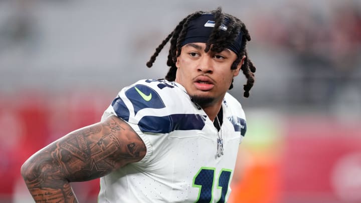 Jan 7, 2024; Glendale, Arizona, USA; Seattle Seahawks wide receiver Jaxon Smith-Njigba (11) warms up prior to facing the Arizona Cardinals at State Farm Stadium. Mandatory Credit: Joe Camporeale-USA TODAY Sports