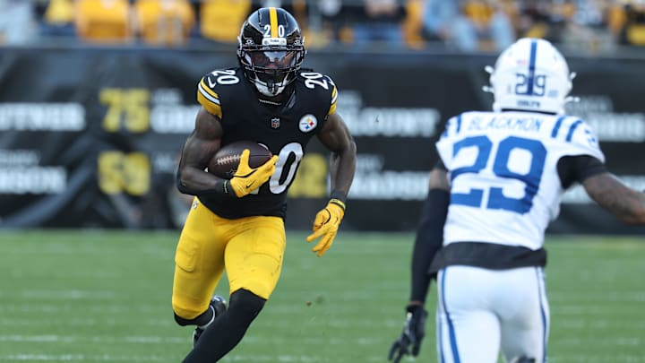 Nov 2, 2025; Pittsburgh, Pennsylvania, USA;  Pittsburgh Steelers running back Kaleb Johnson (20) runs the ball against Indianapolis Colts cornerback Mekhi Blackmon (29) during the third quarter at Acrisure Stadium. Mandatory Credit: Charles LeClaire-Imagn Images